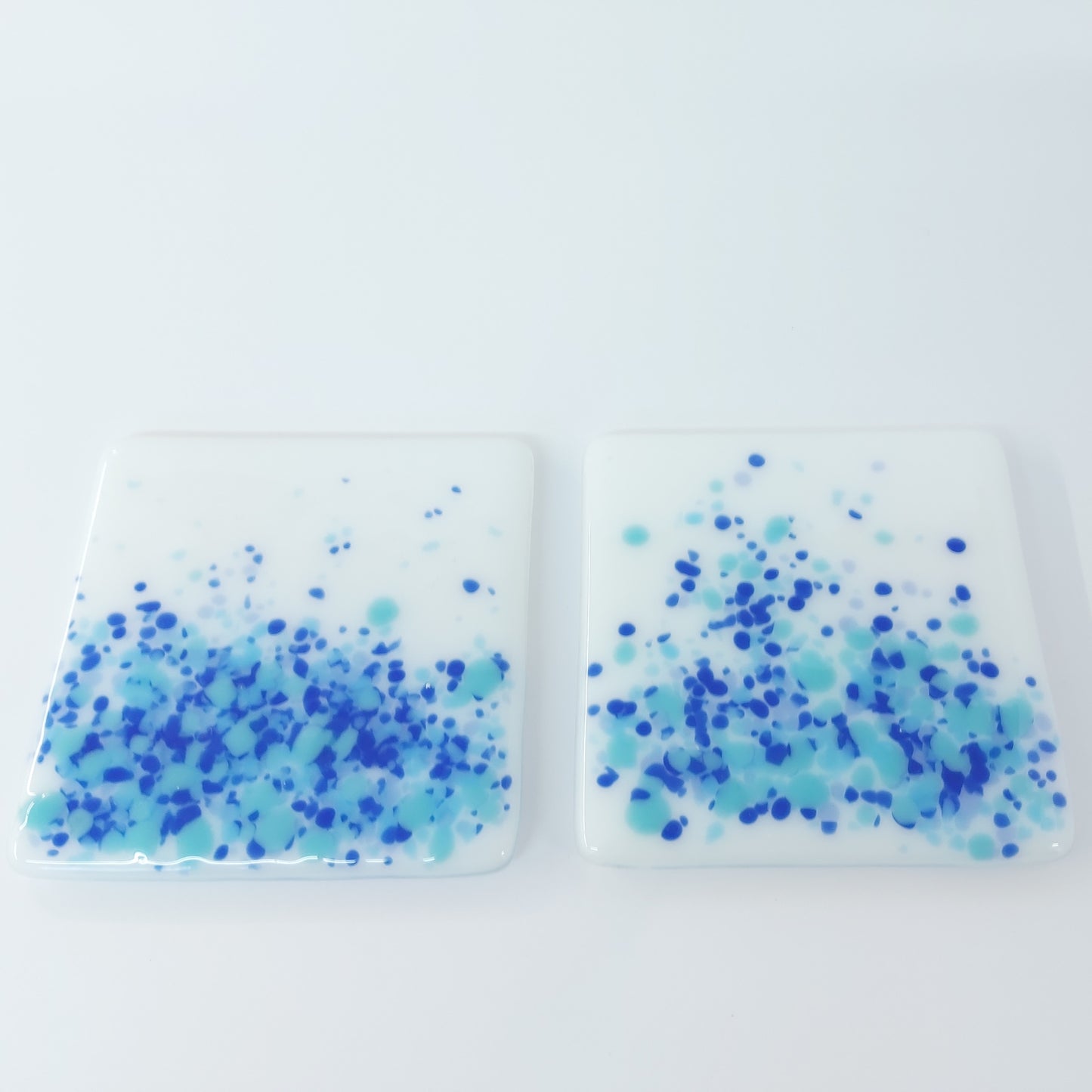 Coasters in White with Blue Tones